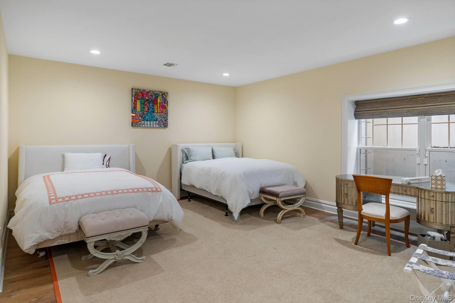 4 Spring Lane Southampton, NY 11968 - Photo 24 of 39 a bedroom with furniture and a bed