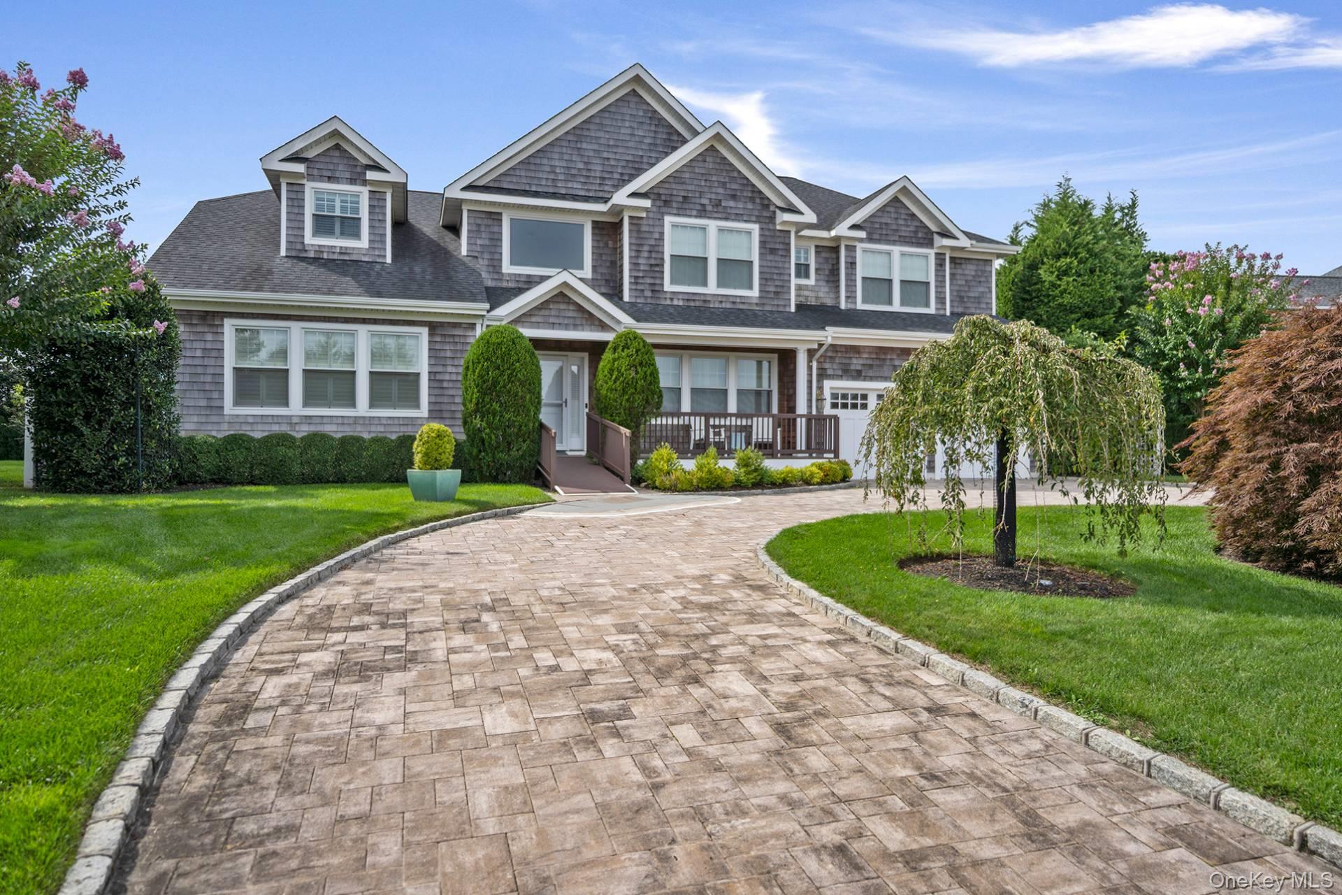 4 Spring Lane Southampton, NY 11968 - Photo 39 of 39 a front view of a house with garden