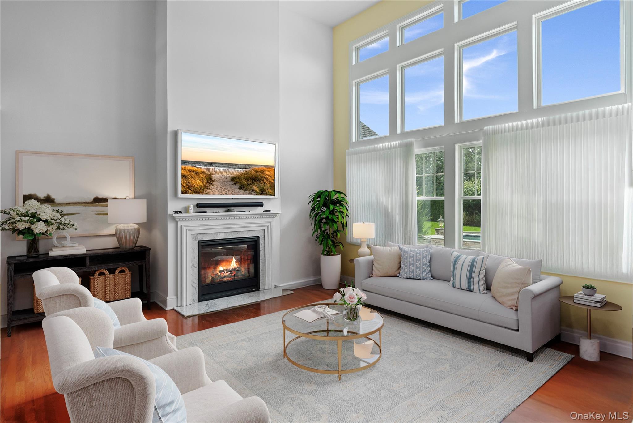 4 Spring Lane Southampton, NY 11968 - Photo 9 of 39 a living room with furniture fireplace and a large window