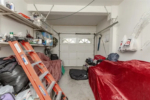 a bed room with a bed and a chandelier