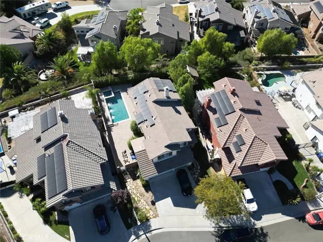 an aerial view of multiple houses with yard