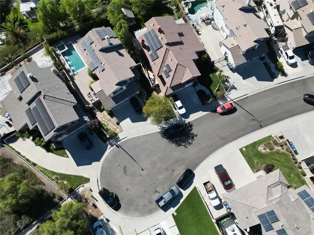 an aerial view of a house with a swimming pool