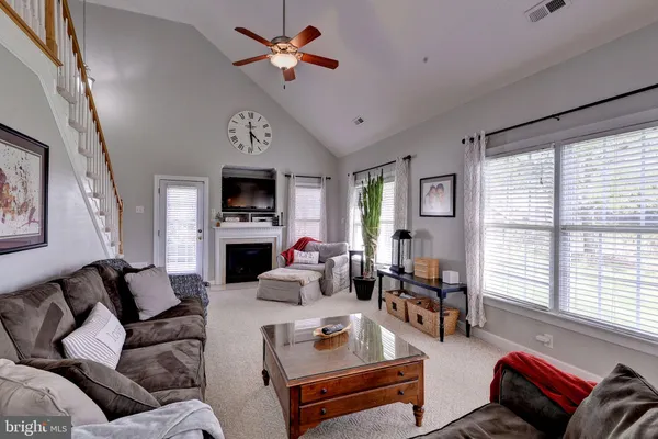 a kitchen with stainless steel appliances granite countertop a stove microwave and cabinets