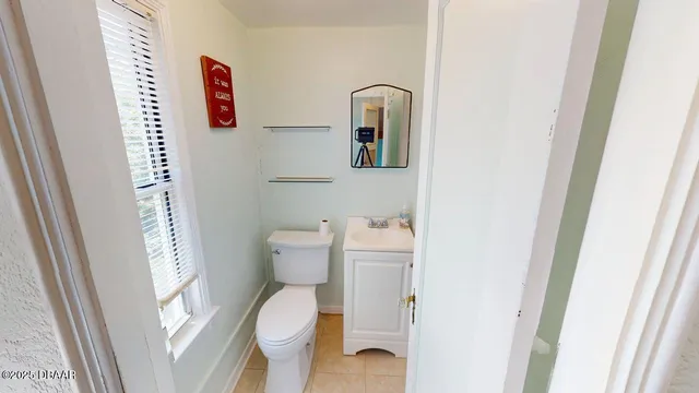 a bathroom with a toilet and a sink