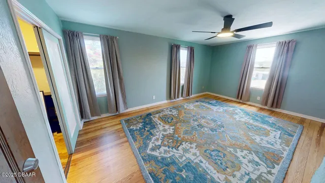 a view of a hallway with windows