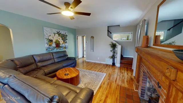 a living room with furniture and a fireplace