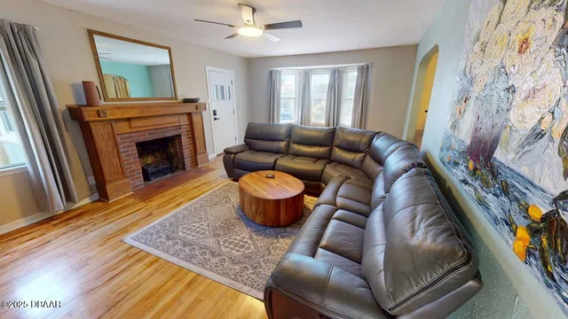 a living room with furniture and a fireplace