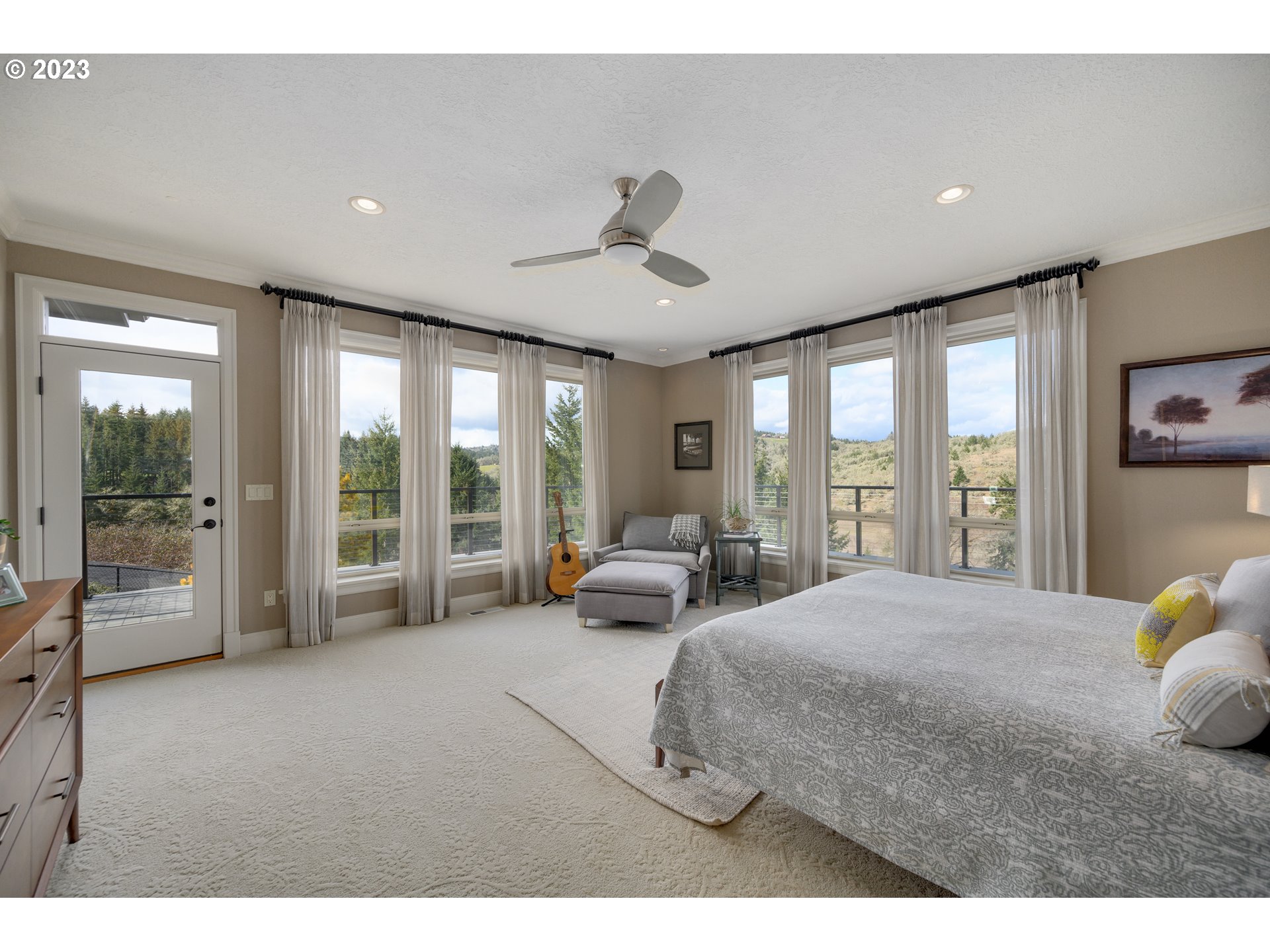 16755 Southwest Masonville Road McMinnville, OR 97128 - Photo 12 of 32 a bedroom with a bed and large glass window