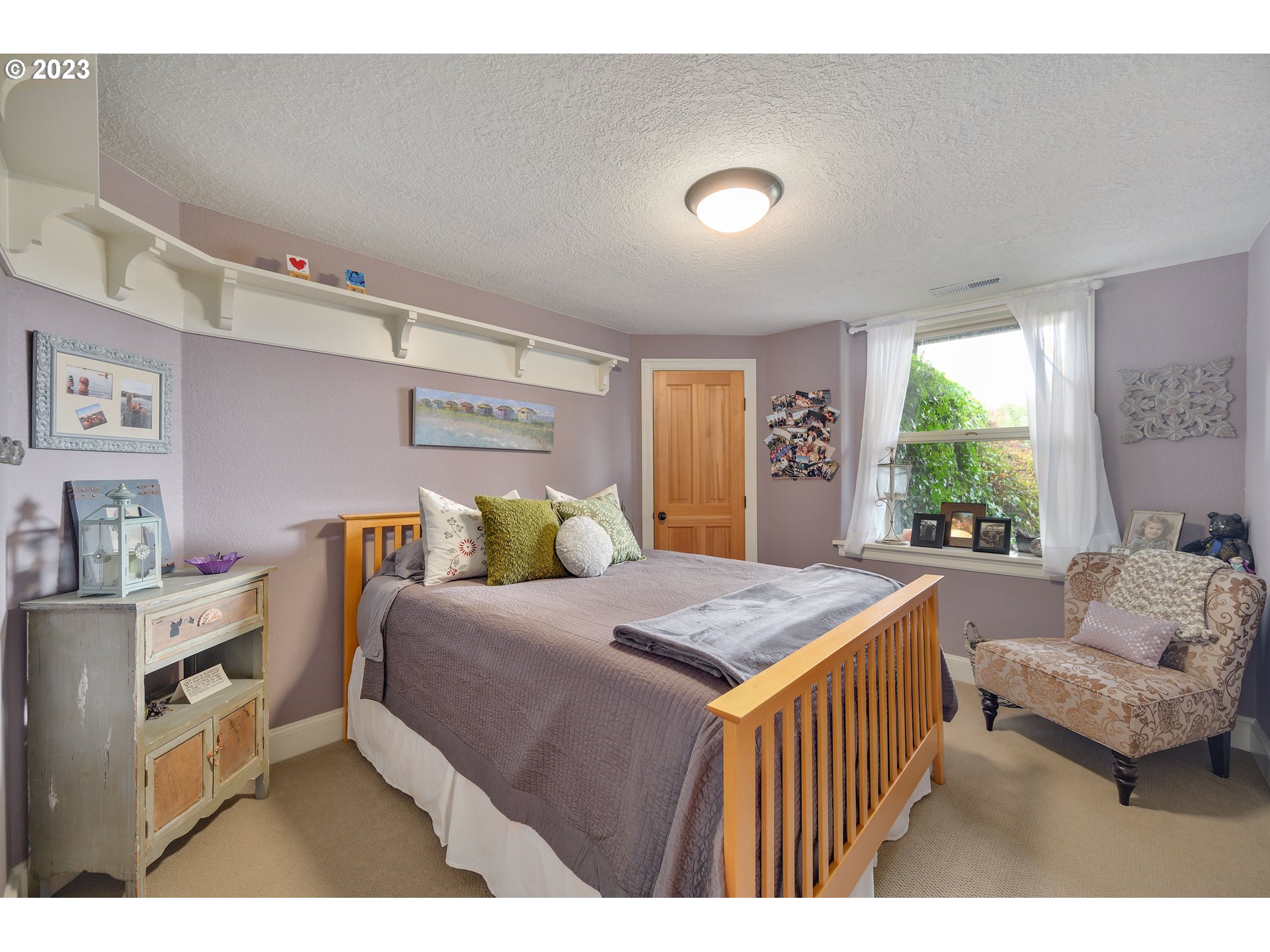 16755 Southwest Masonville Road McMinnville, OR 97128 - Photo 21 of 32 a bedroom with a bed and a large window