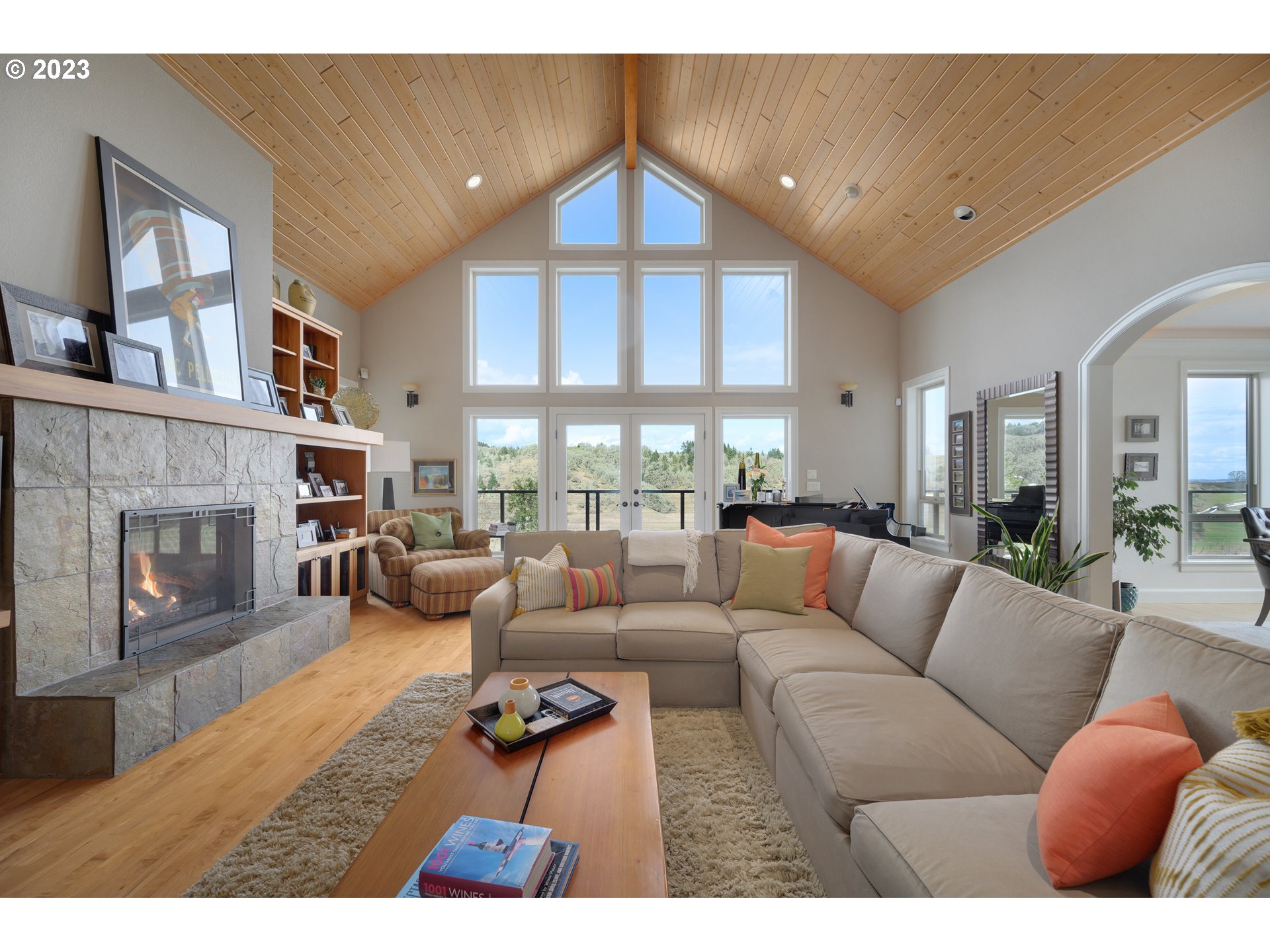 16755 Southwest Masonville Road McMinnville, OR 97128 - Photo 4 of 32 a living room with furniture a fireplace and a large window