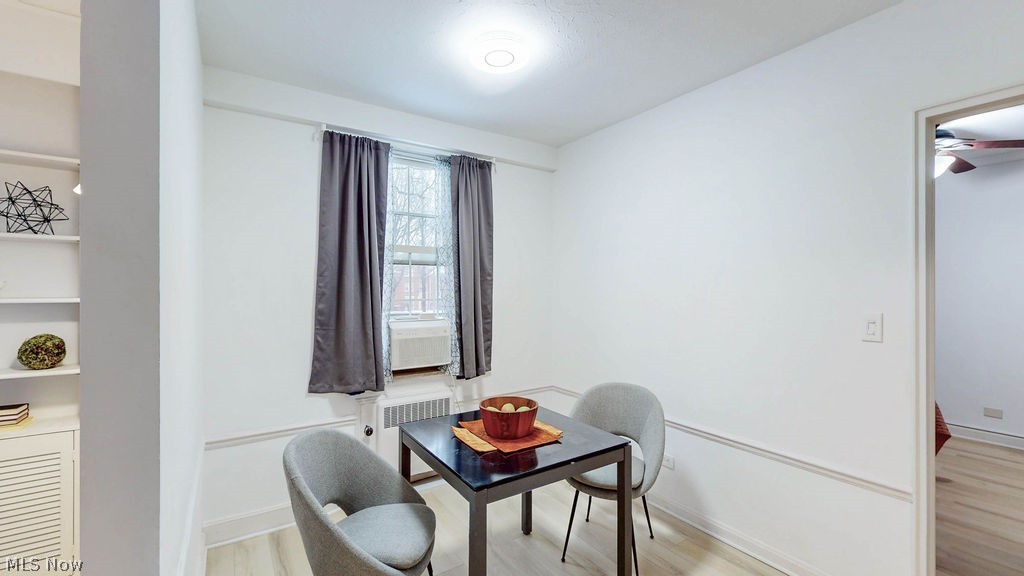 13800 Fairhill Road, Unit 203 Cleveland, OH 44120 - Photo 6 of 28 Dining room perfectly situated between living room and kitchen, featuring white oak style LVP flooring.