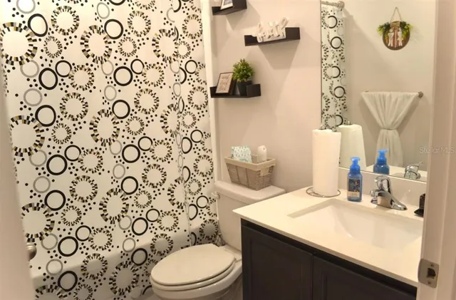 a bathroom with a sink and a toilet