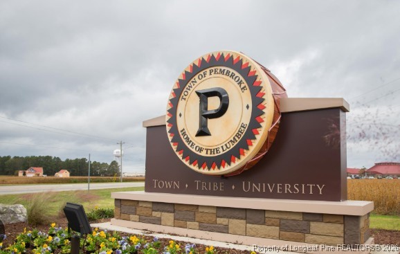 711 Nc Highway Pembroke, NC 28372 - Photo 4 of 8 a view of a house with a swimming pool