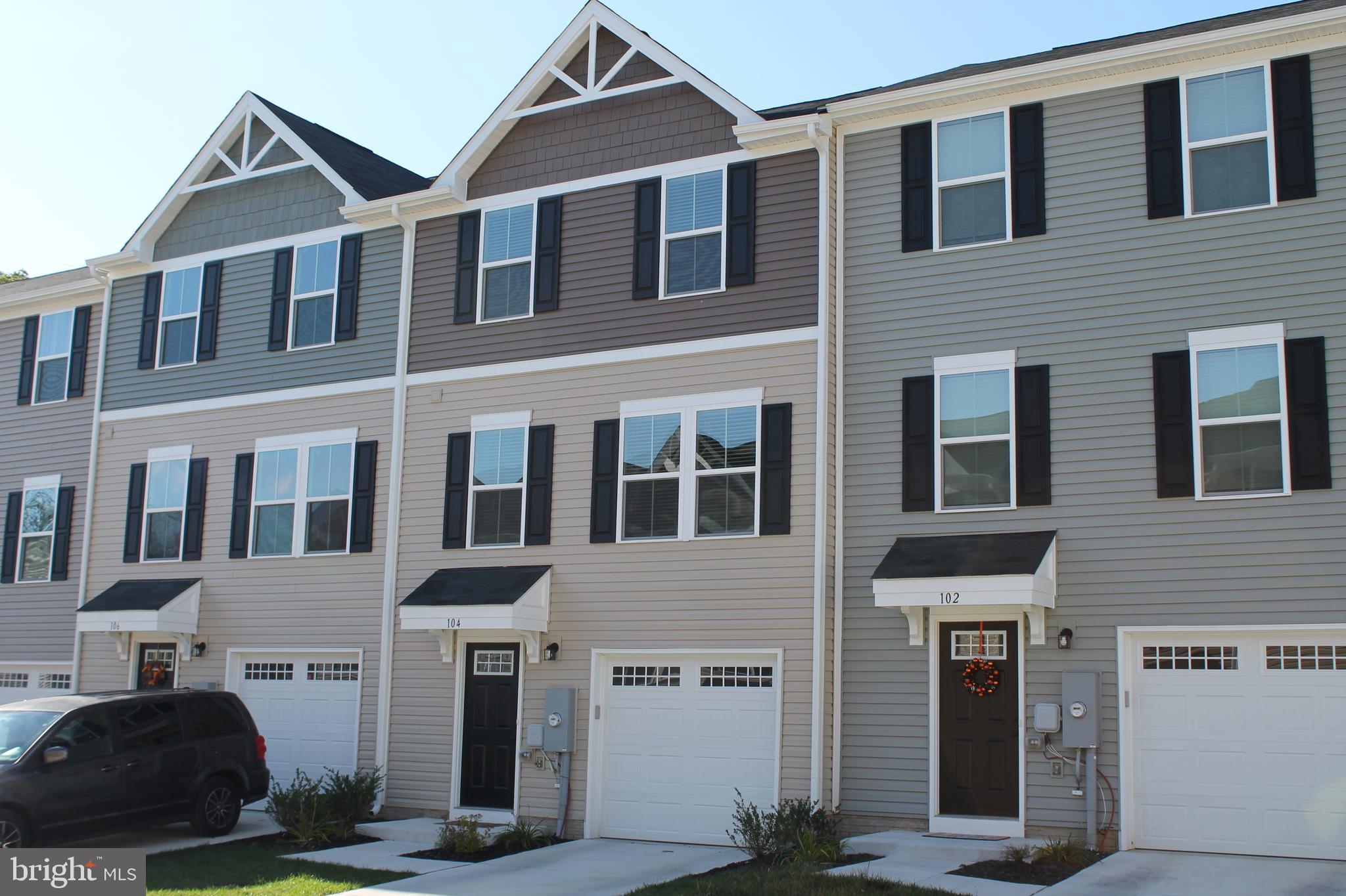 104 Reign Way Winchester, VA 22603 - Photo 1 of 27 a front view of a house with a yard