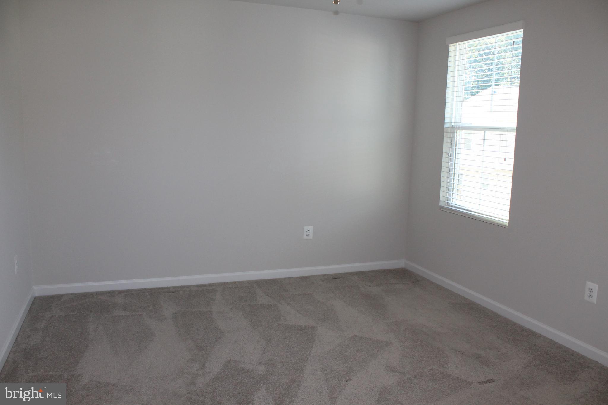 104 Reign Way Winchester, VA 22603 - Photo 15 of 27 an empty room with a window