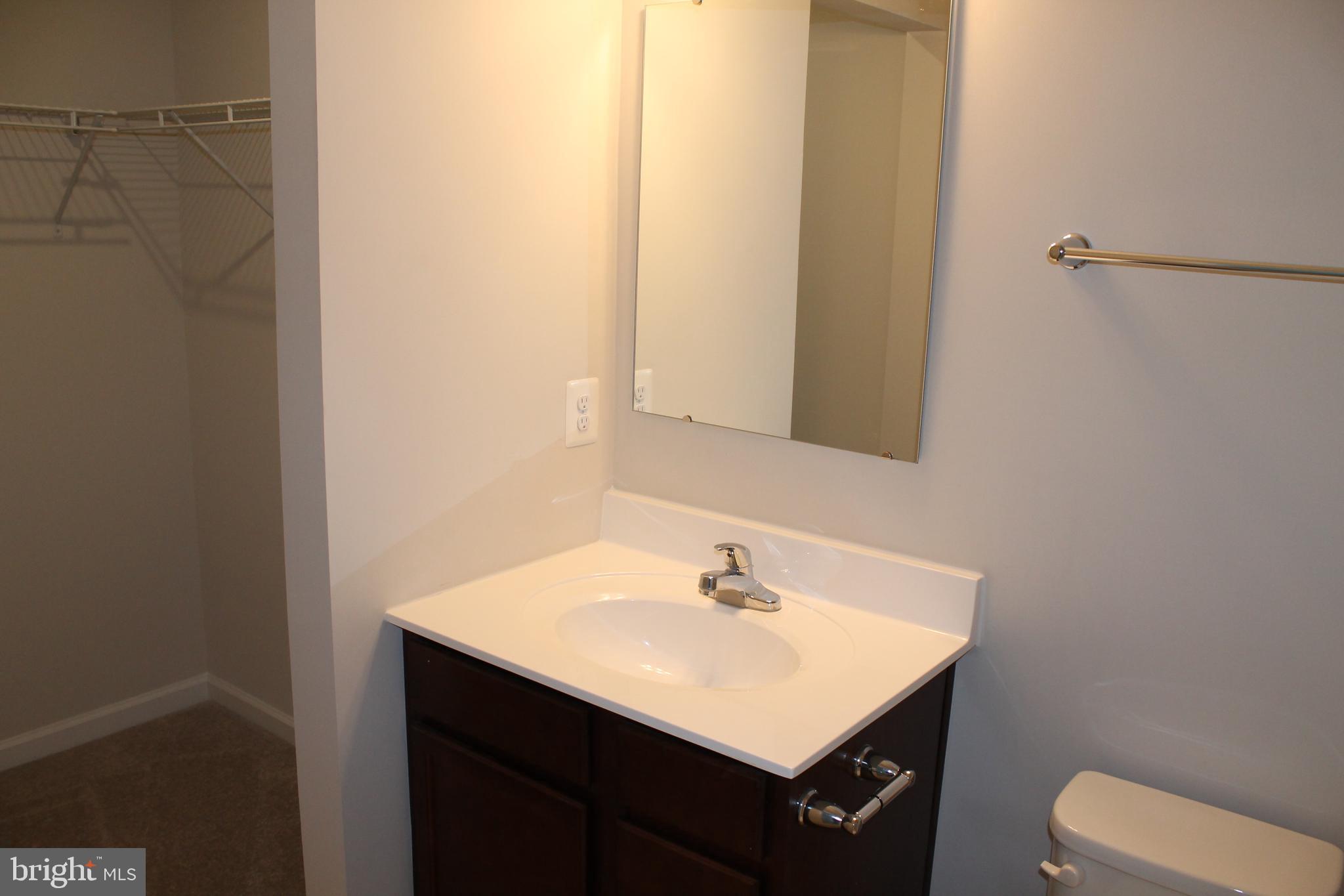 104 Reign Way Winchester, VA 22603 - Photo 17 of 27 a bathroom with a sink and a toilet