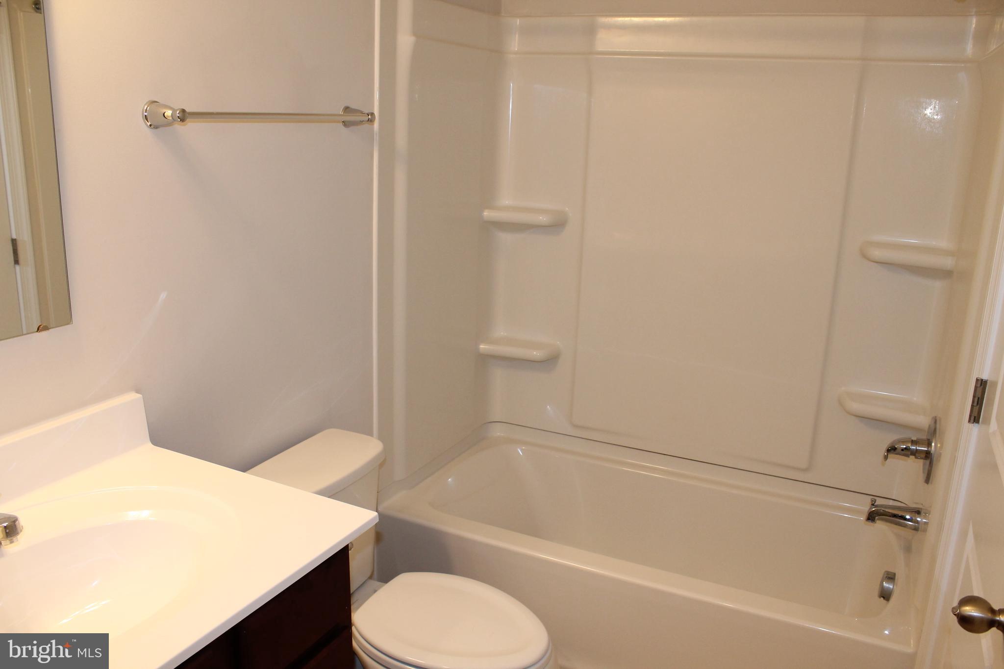 104 Reign Way Winchester, VA 22603 - Photo 18 of 27 a bathroom with a sink a toilet and shower
