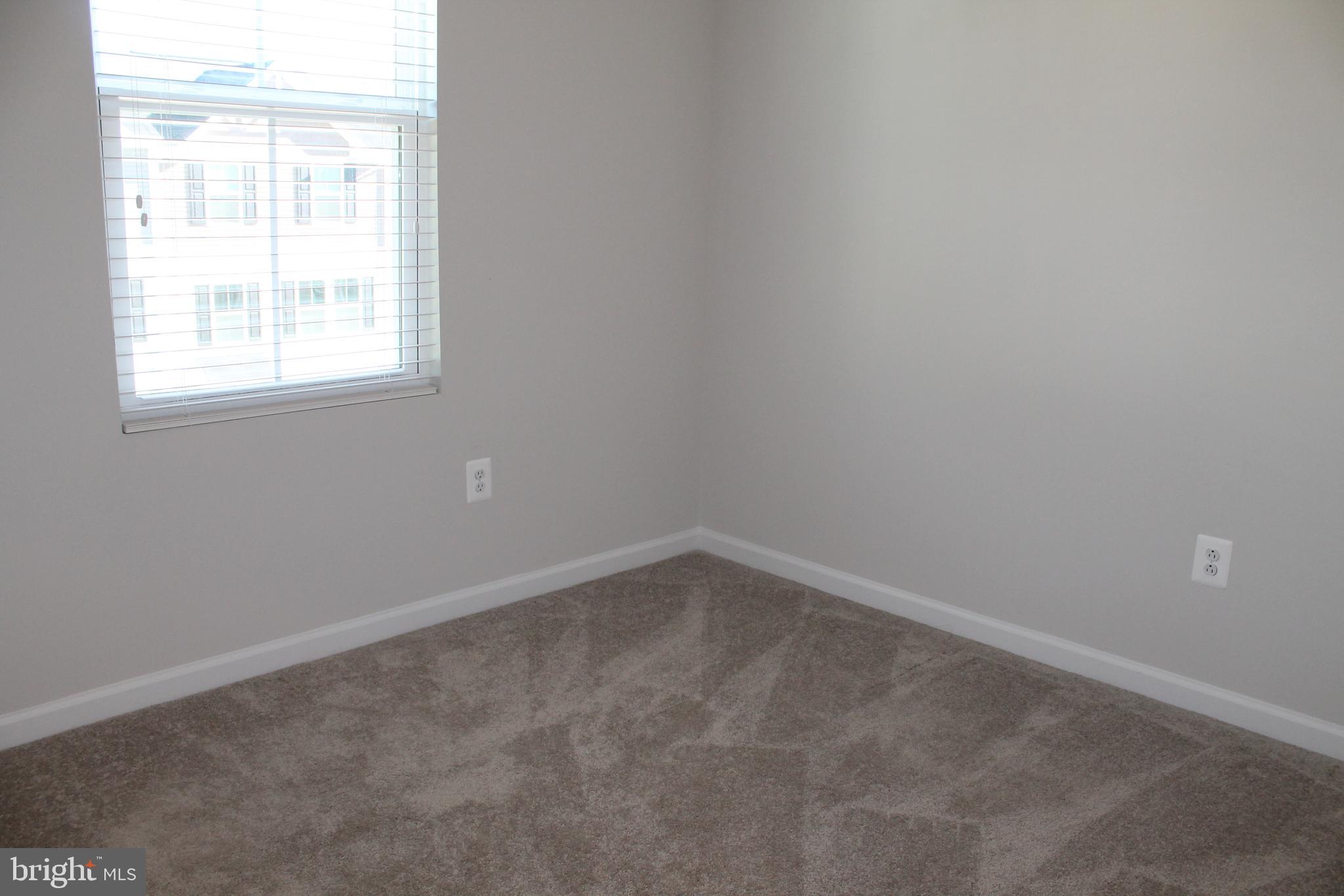 104 Reign Way Winchester, VA 22603 - Photo 22 of 27 an empty room with a window