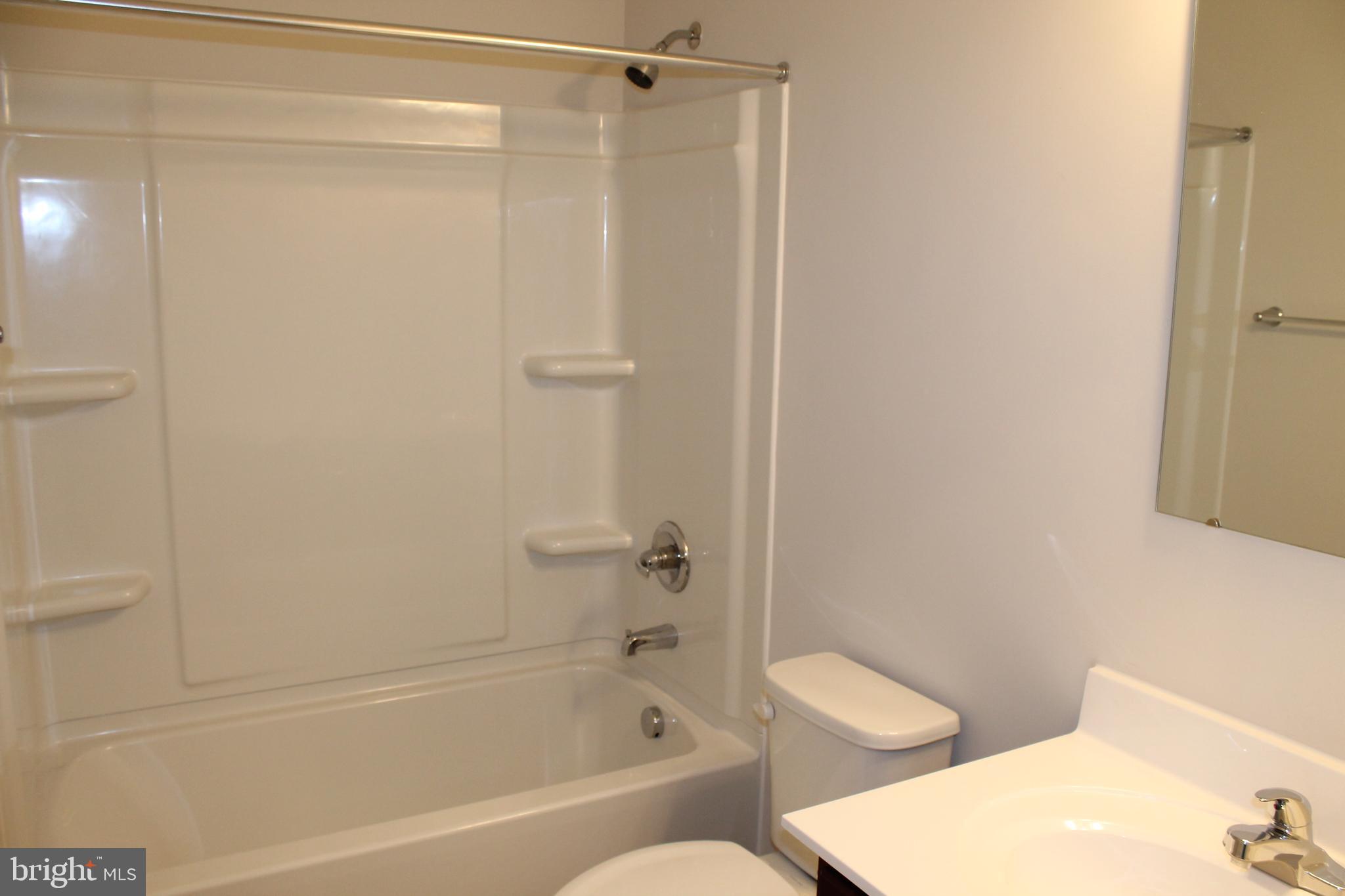104 Reign Way Winchester, VA 22603 - Photo 23 of 27 a view of a bathroom with a tub and toilet