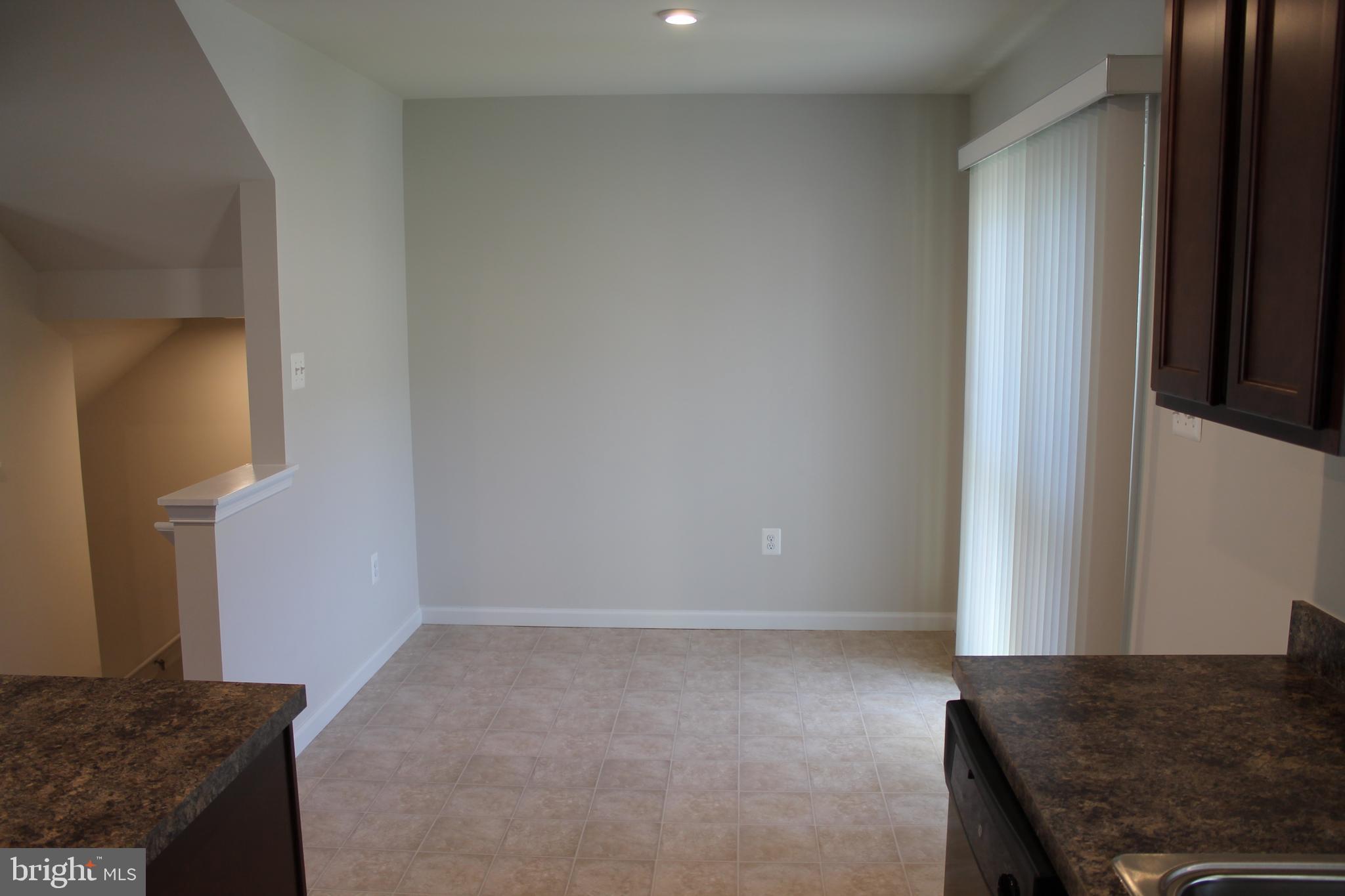 104 Reign Way Winchester, VA 22603 - Photo 9 of 27 a view of kitchen and hallway