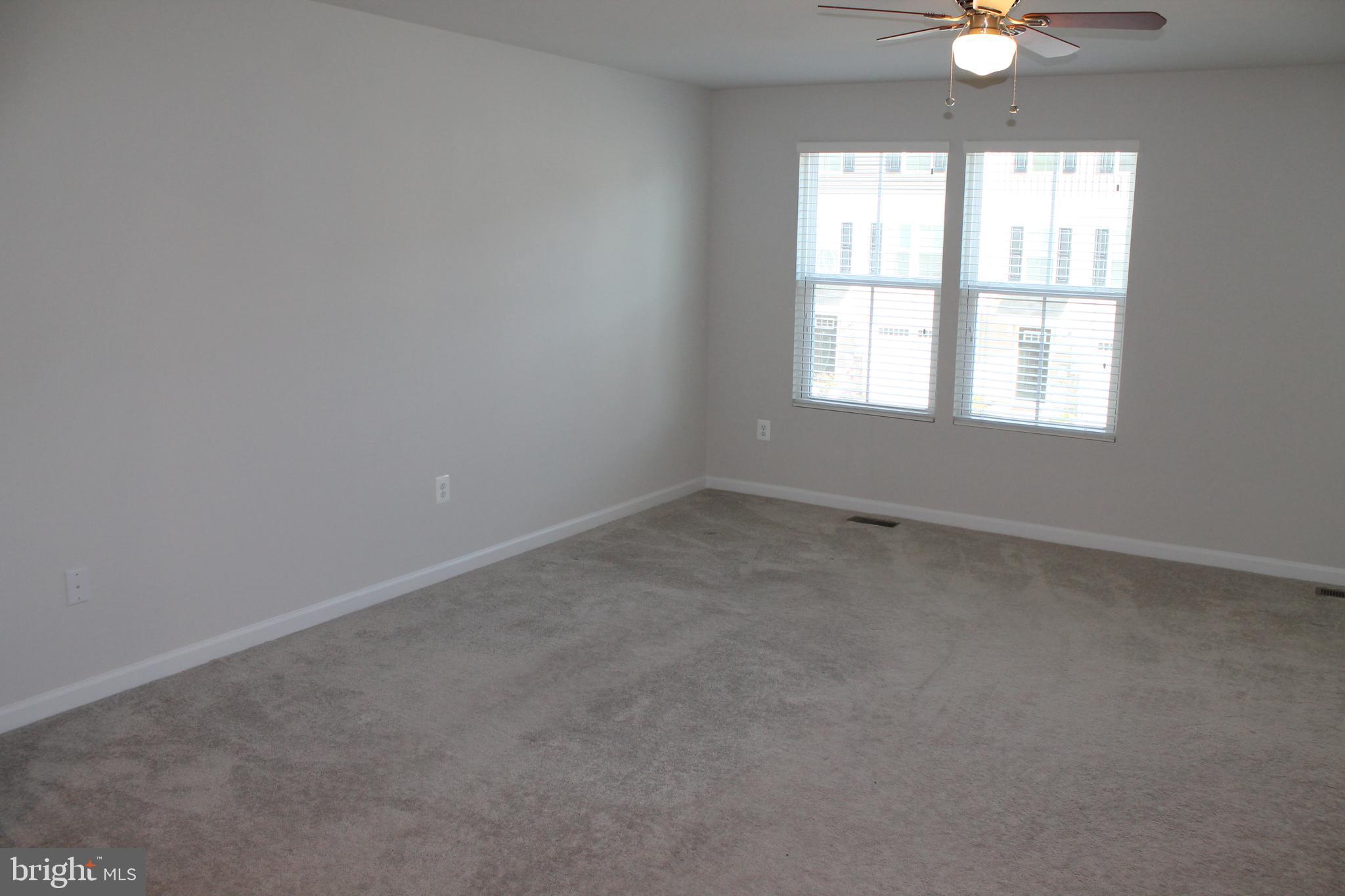 104 Reign Way Winchester, VA 22603 - Photo 10 of 27 an empty room with a window