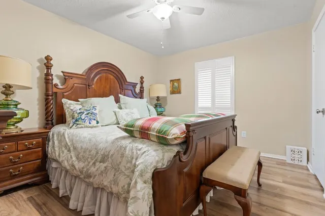 a bedroom with a bed and a dresser