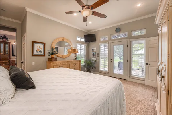 a large bedroom with a large bed and a large window