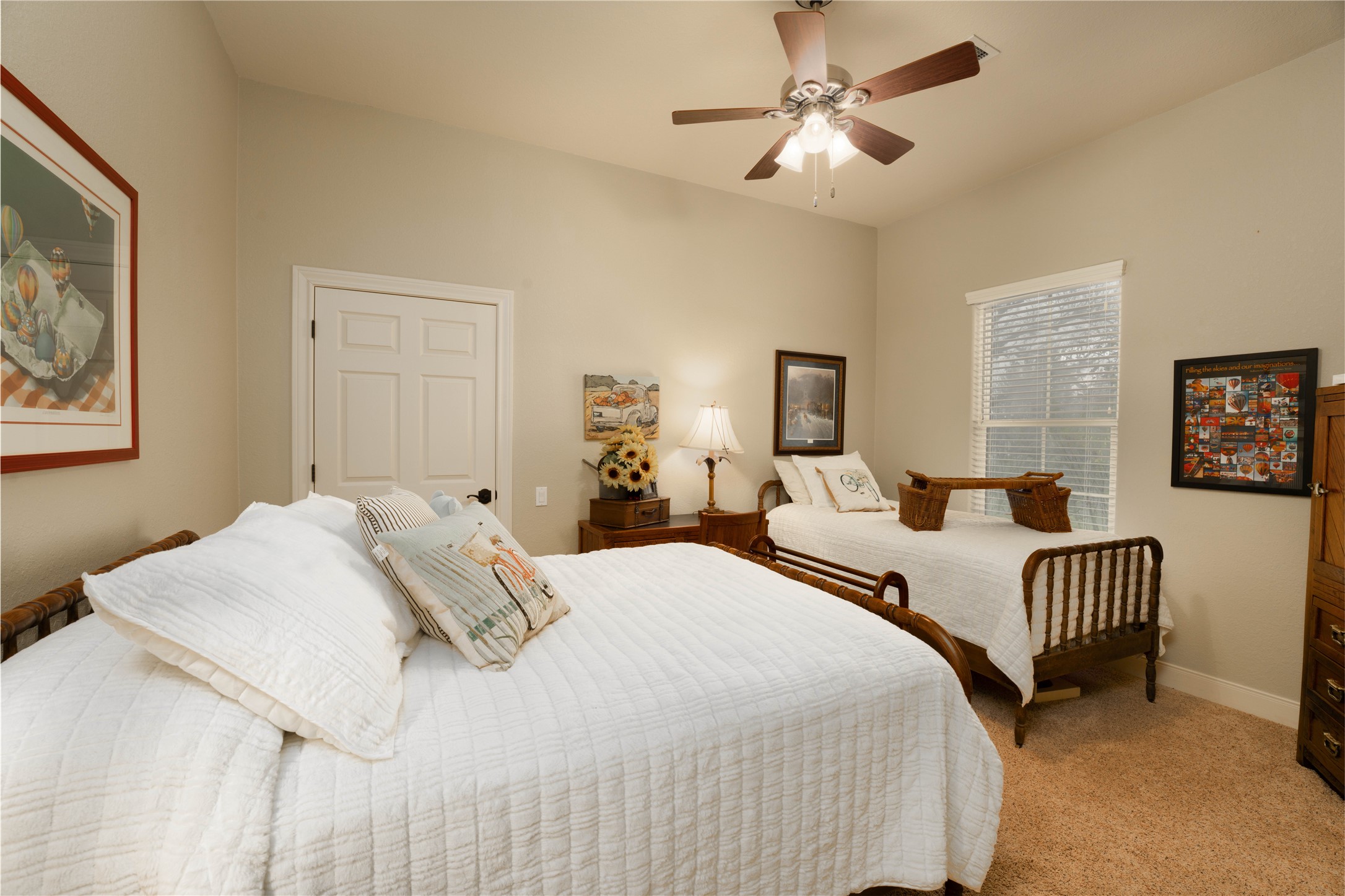 2007 FM 2434 Weimar, TX 78962 - Photo 20 of 44 a bedroom with two beds and a chandelier