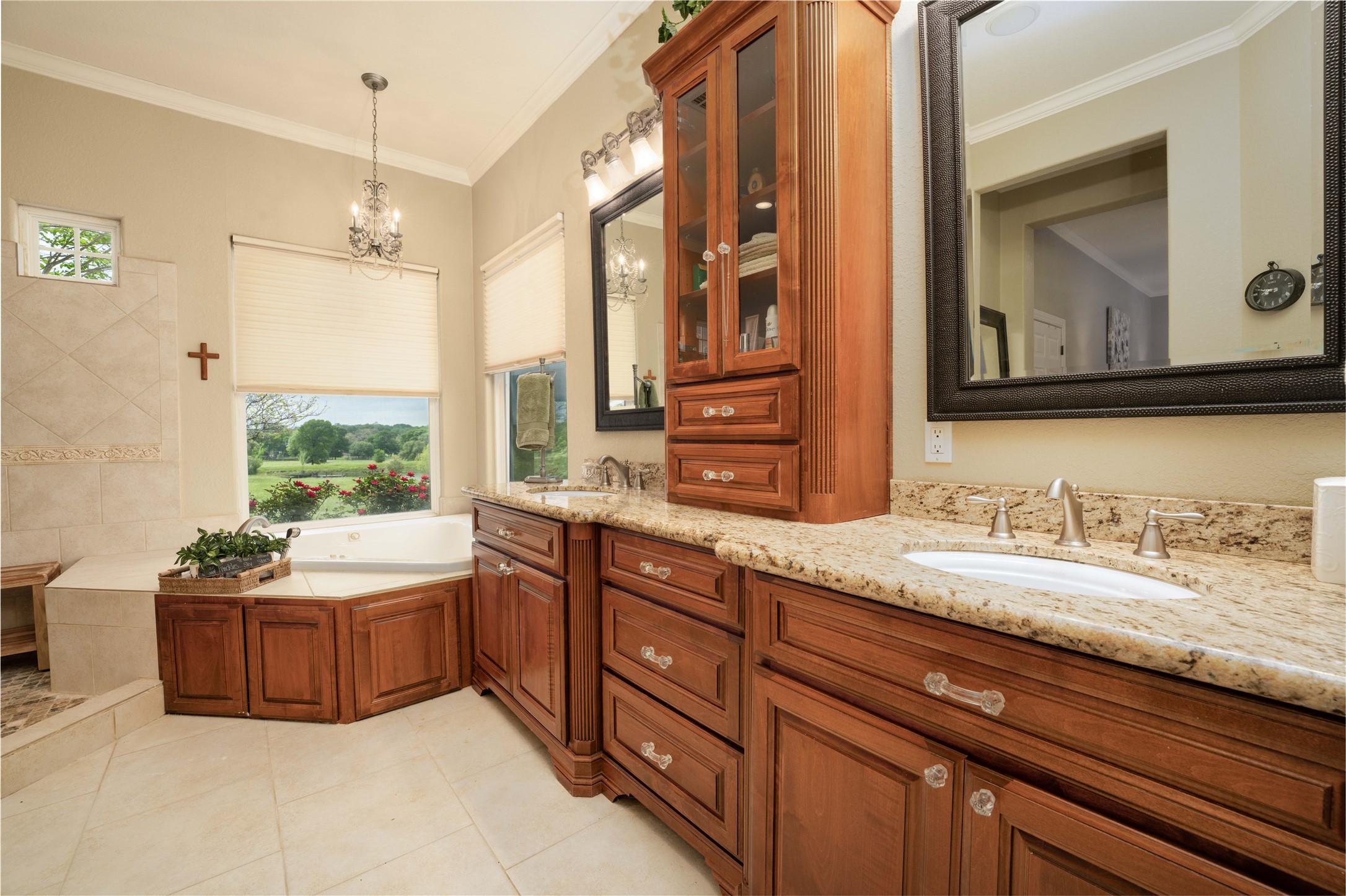 2007 FM 2434 Weimar, TX 78962 - Photo 28 of 44 a bathroom with a granite countertop double vanity sink a mirror and a bathtub