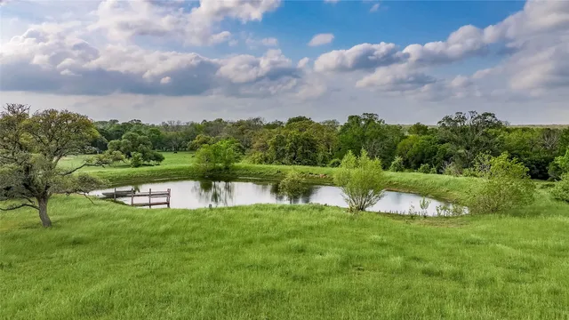 a view of a lake with a big yard