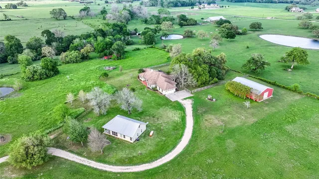 a view of a play house with a backyard