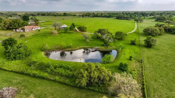 a view of a lake with a houses yard