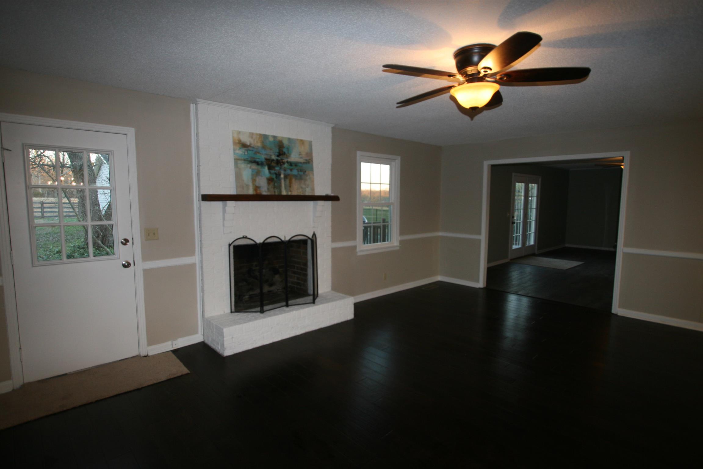 1158 Carter Blake Road Tullahoma, TN 37388 - Photo 10 of 17 Den has fireplace, hardwood floors and is open to the kitchen.