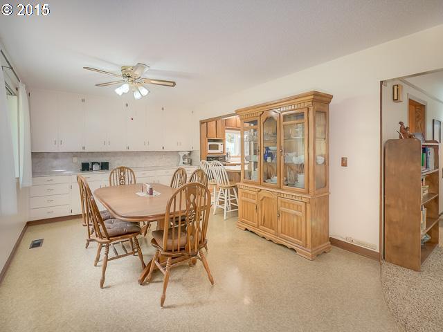 17366 South Gronlund Road Oregon City, OR 97045 - Photo 4 of 16 a view of a dining room with furniture and a chandelier