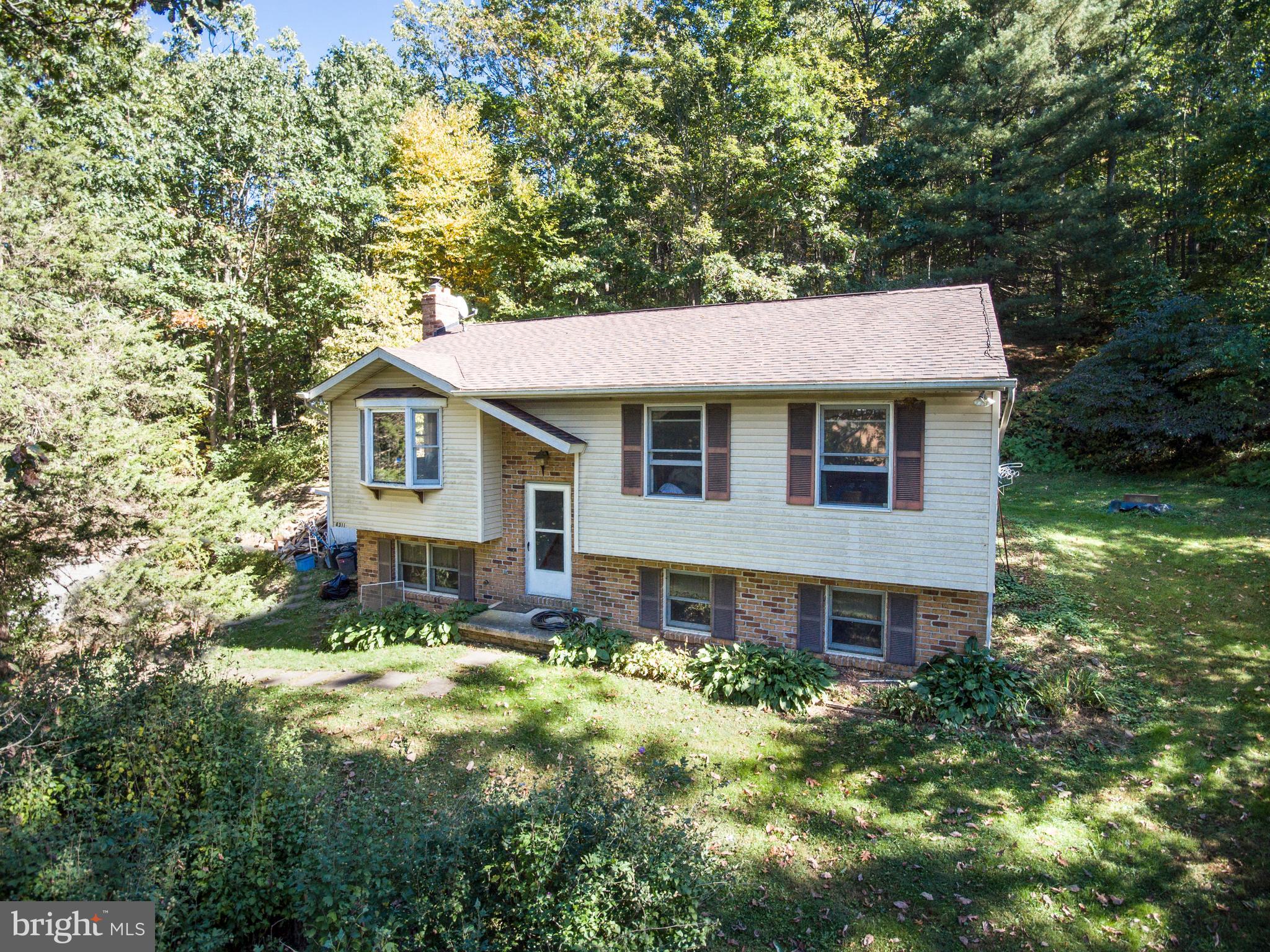 4311 York Road, Unit 1 Manchester, MD 21102 - Photo 1 of 42 a front view of a house with a yard