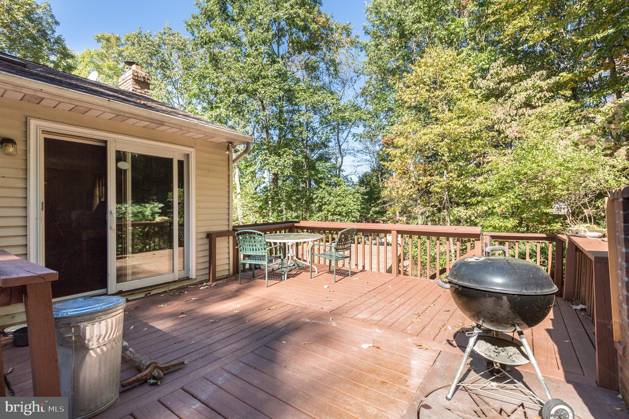 4311 York Road, Unit 1 Manchester, MD 21102 - Photo 30 of 42 a balcony with wooden floor and outdoor seating