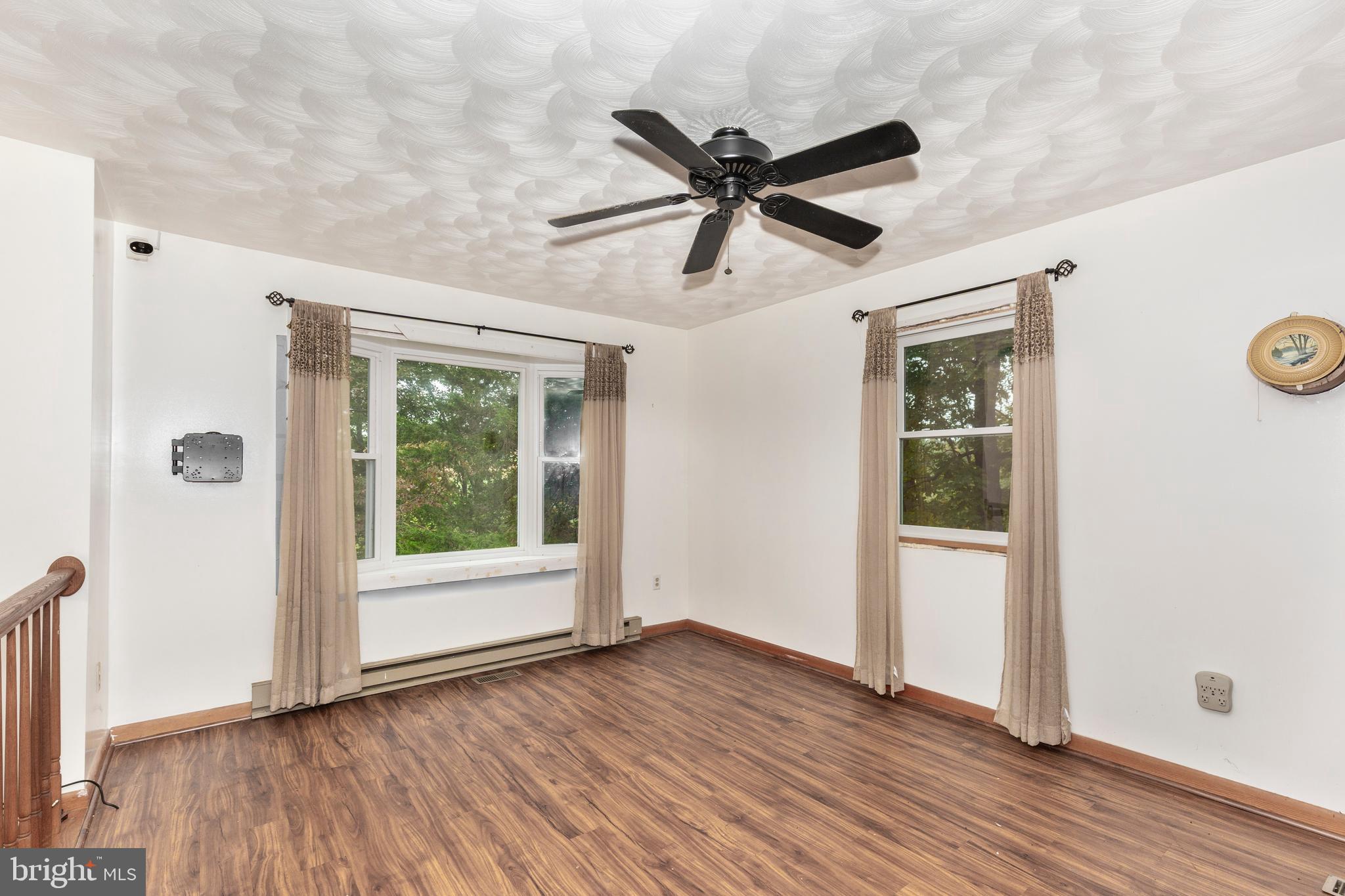 4311 York Road, Unit 1 Manchester, MD 21102 - Photo 4 of 42 wooden floor in an empty room with a window