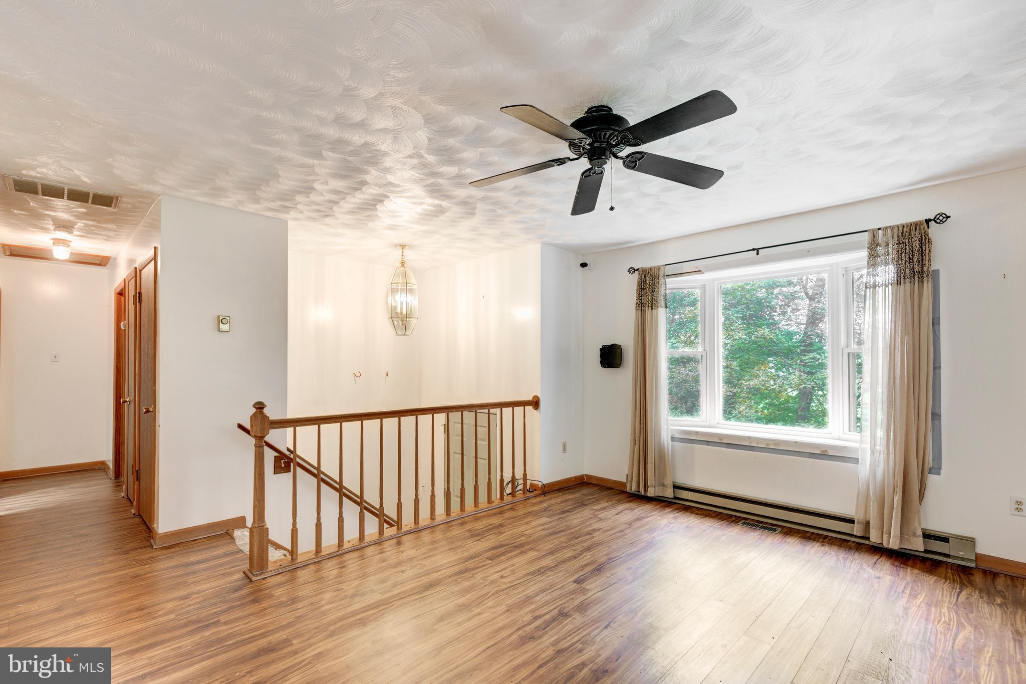 4311 York Road, Unit 1 Manchester, MD 21102 - Photo 5 of 42 a view of empty room with wooden floor and fan