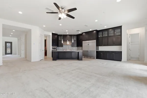 a view of kitchen and refrigerator