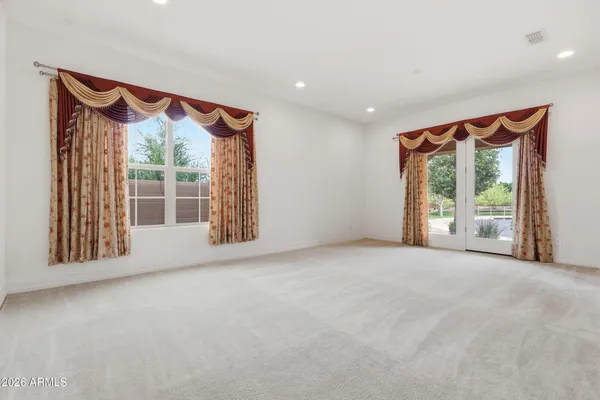 a view of a livingroom with kitchen and living room view