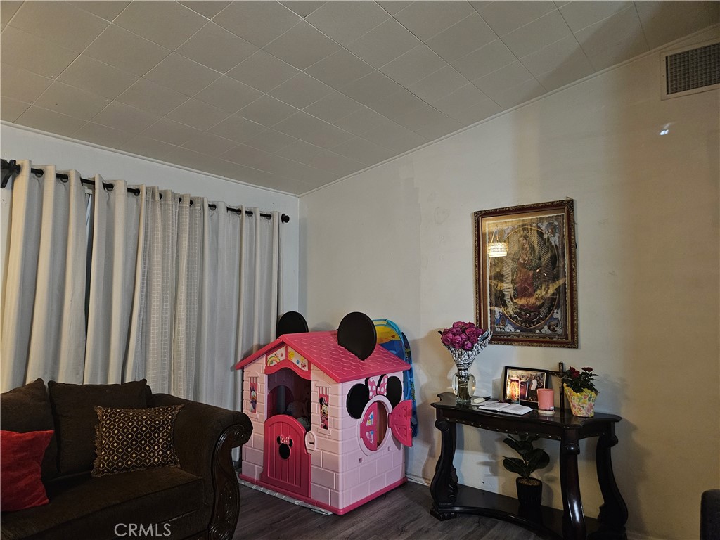 537 East 3rd Street Rialto, CA 92376 - Photo 17 of 47 a bedroom with a bed and a window
