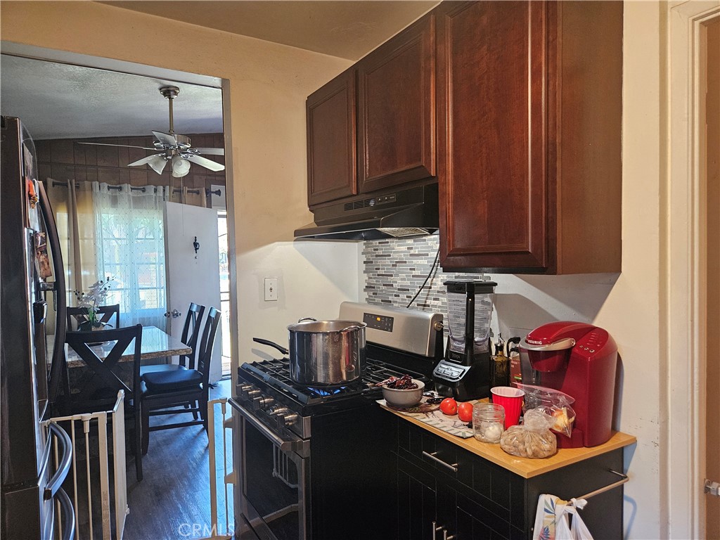 537 East 3rd Street Rialto, CA 92376 - Photo 18 of 47 a kitchen with stainless steel appliances granite countertop a refrigerator and stove