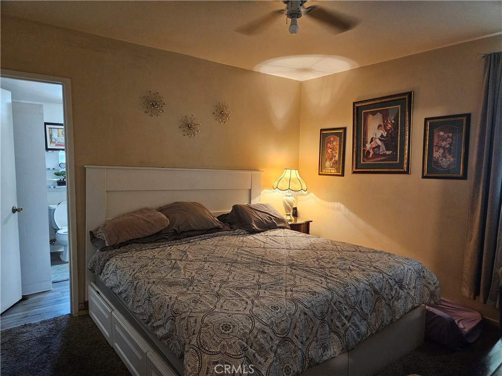537 East 3rd Street Rialto, CA 92376 - Photo 29 of 47 a bedroom with a bed and painting on the wall