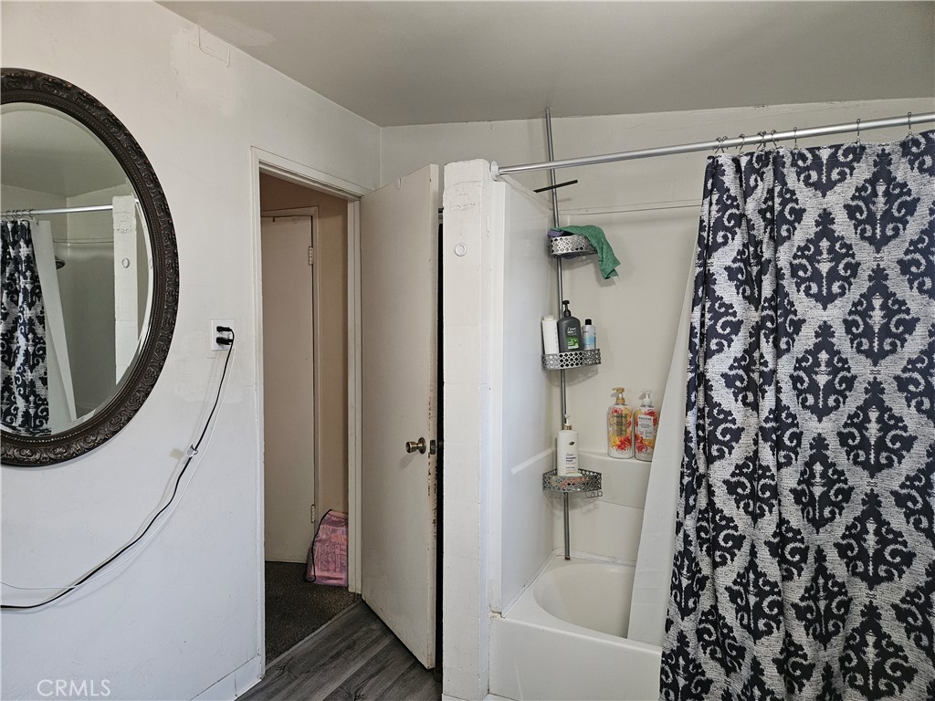 537 East 3rd Street Rialto, CA 92376 - Photo 32 of 47 a bathroom with a bathtub and shower