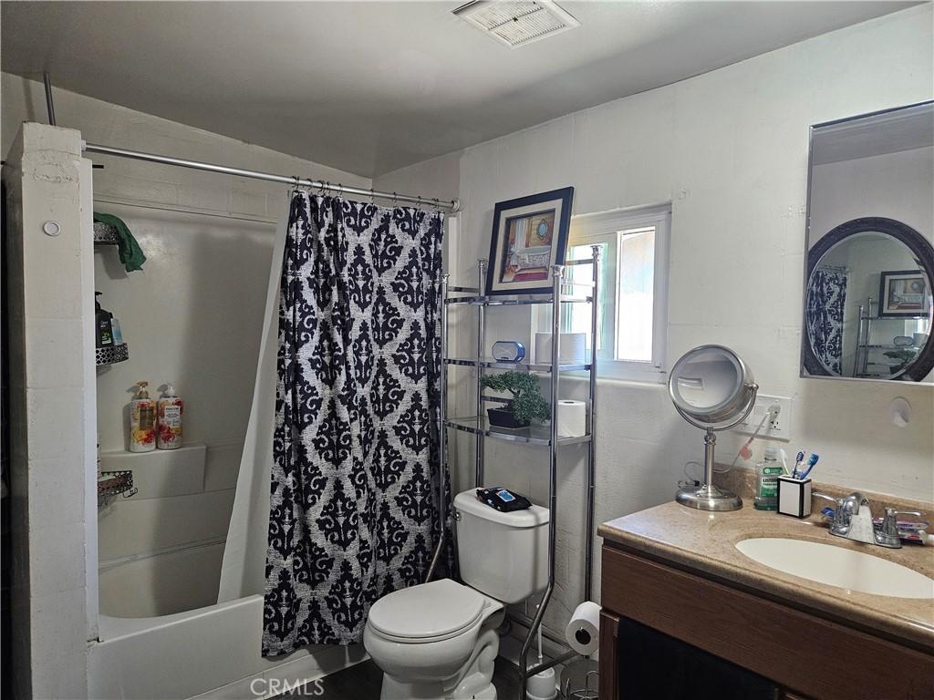 537 East 3rd Street Rialto, CA 92376 - Photo 33 of 47 a bathroom with a sink toilet and shower