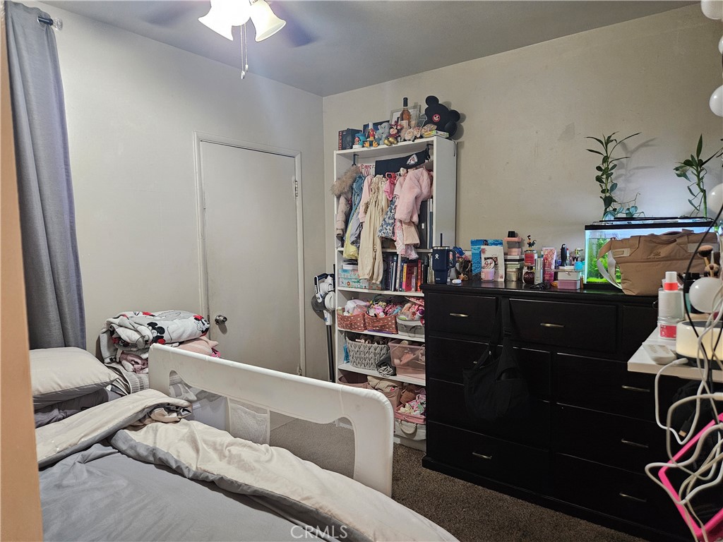 537 East 3rd Street Rialto, CA 92376 - Photo 34 of 47 a bedroom with a bed and a dresser