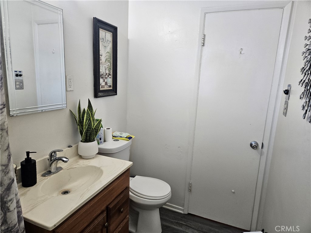 537 East 3rd Street Rialto, CA 92376 - Photo 40 of 47 a bathroom with a sink toilet and a mirror