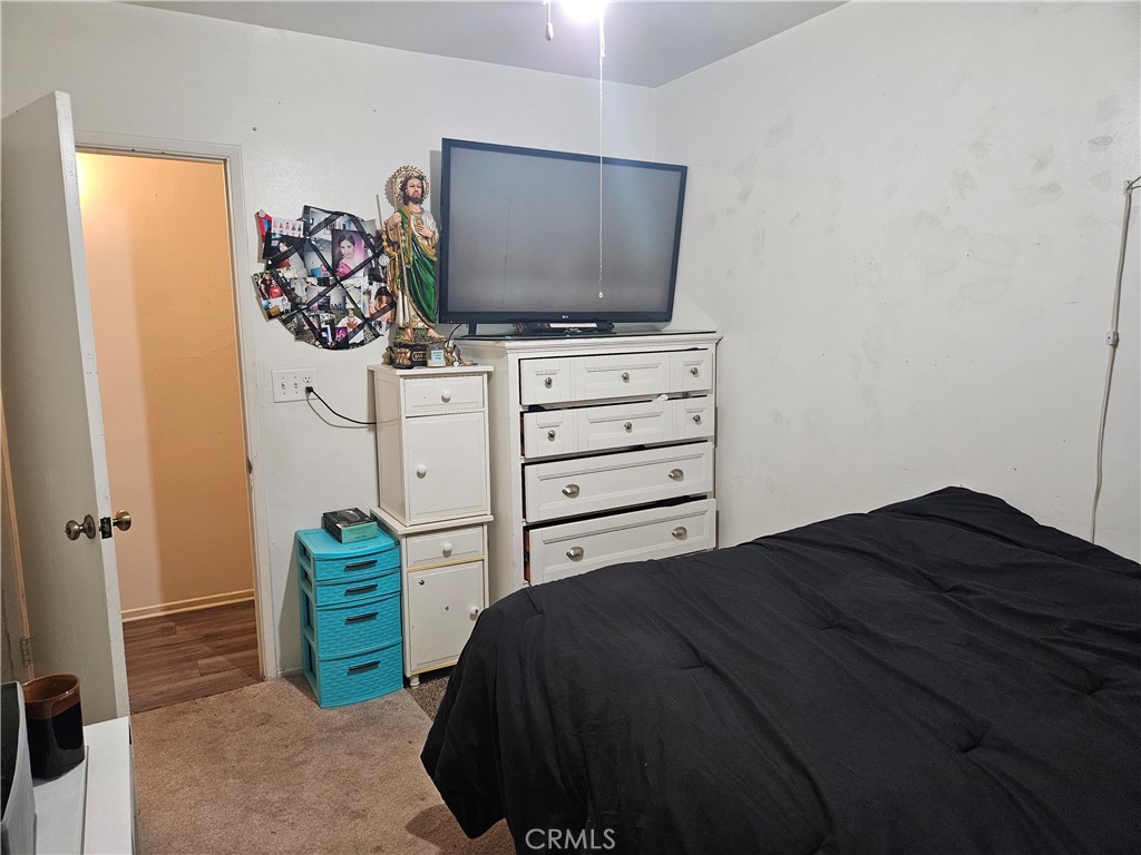 537 East 3rd Street Rialto, CA 92376 - Photo 42 of 47 a bedroom with a bed and a flat screen tv