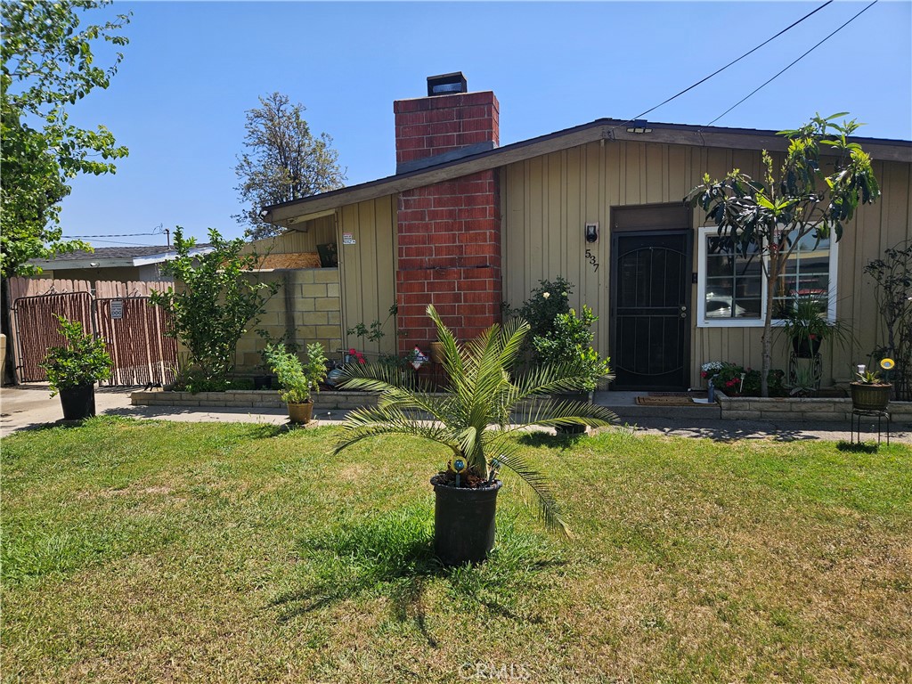537 East 3rd Street Rialto, CA 92376 - Photo 6 of 47 a front view of a house with garden