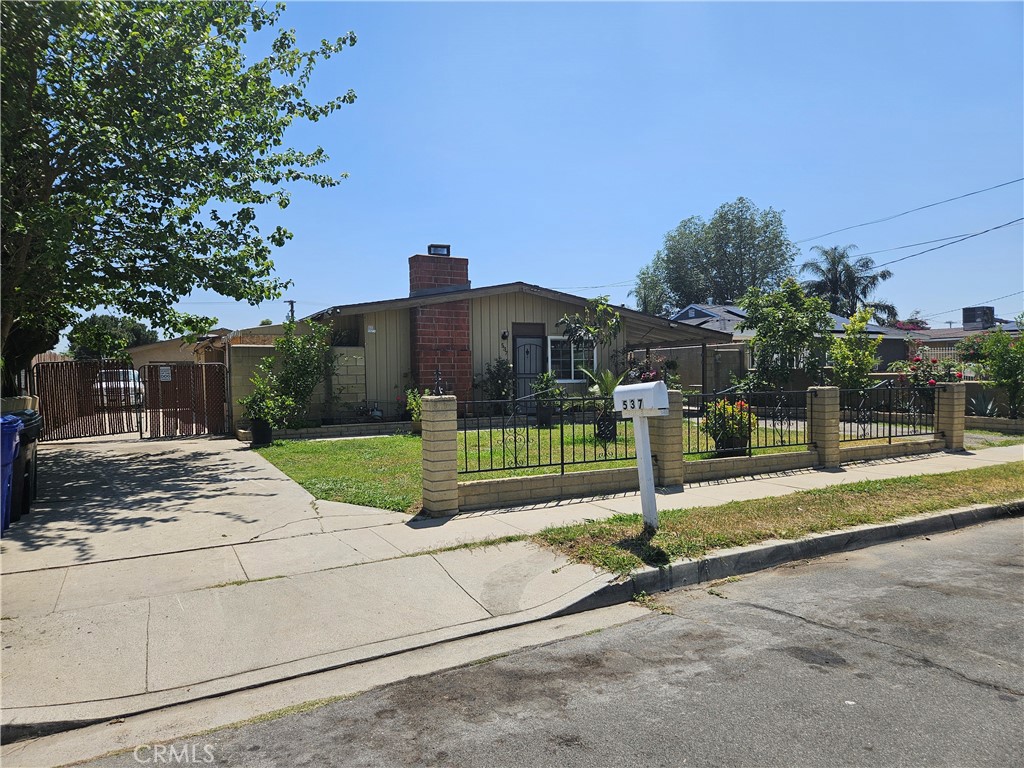 537 East 3rd Street Rialto, CA 92376 - Photo 7 of 47 a view of a house with backyard and tree